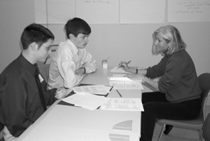 Image of two students at a disabilities meeting with a career counselor.