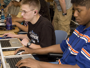 Photo of students working on laptop computers.