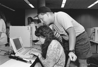 Photo of Anna and Lloyd in the computer lab.
